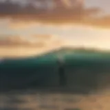 Surfer riding a massive wave at sunset