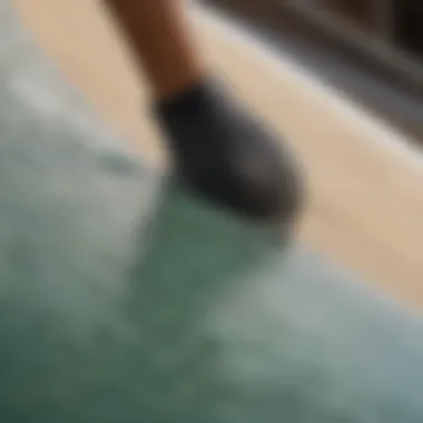 Close-up of a surfboard gripped firmly on the 4-foot quarter pipe