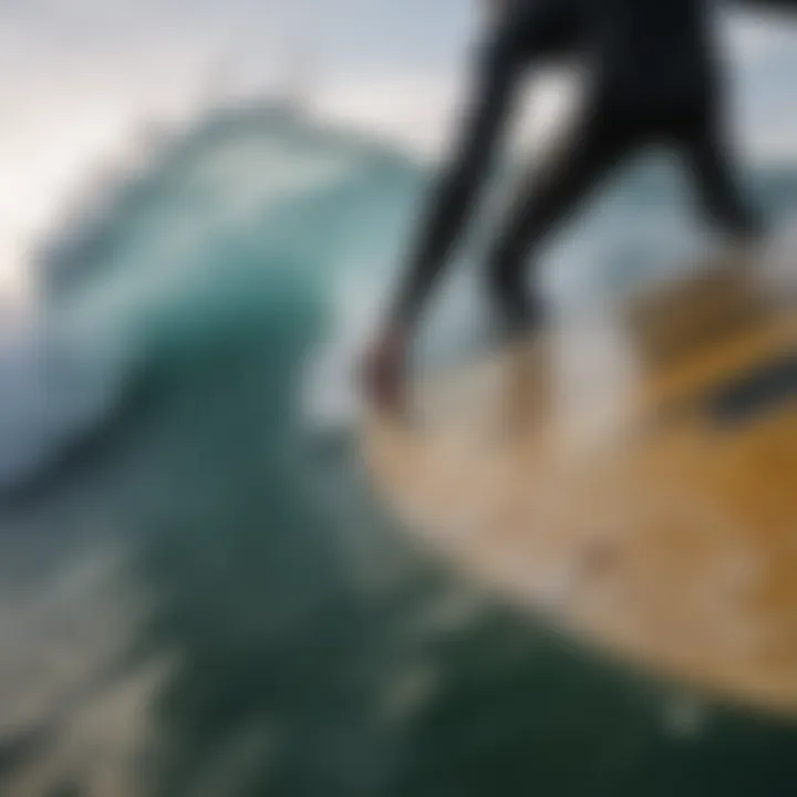 A close-up of a surfboard fin cutting through the water