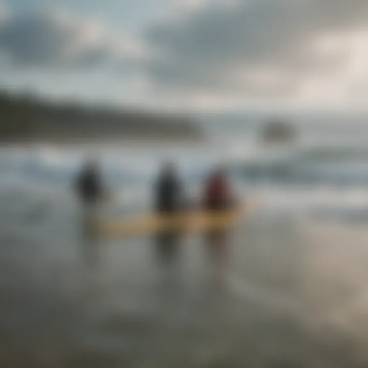 A group of surfers sitting on their boards waiting for the perfect wave