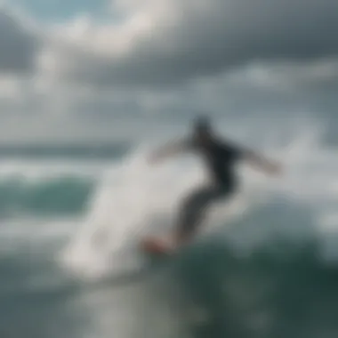 Aerial view of ocean rodeo kiteboarder riding the waves