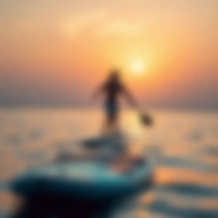 A paddleboarder practicing balance techniques on calm waters at sunset