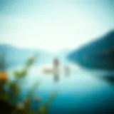 Paddleboarding on a Tranquil Lake A serene lake landscape with a paddleboarder gliding smoothly across the water