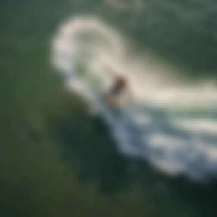 Aerial view of a pro skimboarder launching into the air for a stylish grab trick