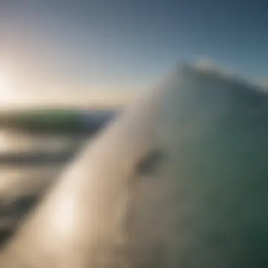 Close-up of surfboard against the backdrop of ocean