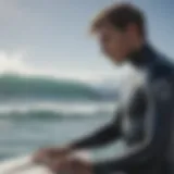 Surfer in Ripcurl wetsuit checking measurements