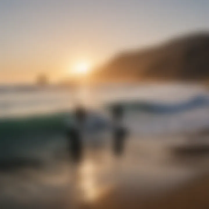 Group of surfers catching waves in the early morning light