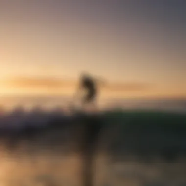 Silhouette of a surfer riding an electric surfboard at sunset