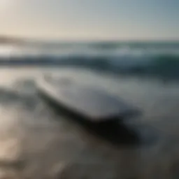 Foil board with sleek carbon fiber design cutting through the waves