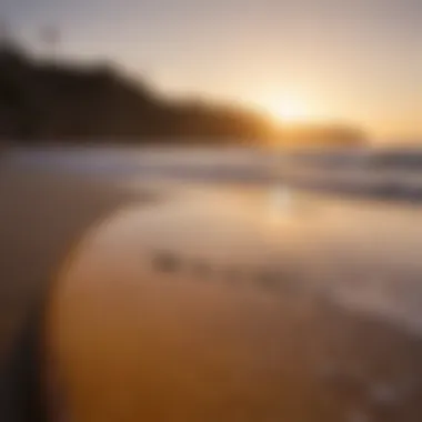 Sunrise illuminating surfboard on the beach