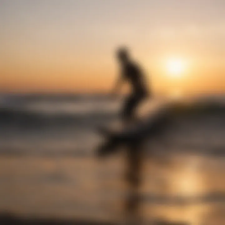 Sunset silhouette of a surfer against the horizon