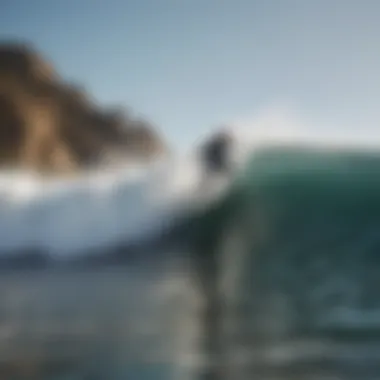 Surfer catching a wave in Malibu