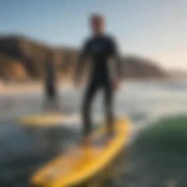 Surfing instructor guiding a student in Malibu