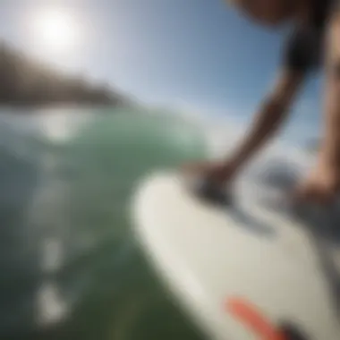 Surfer applying a GoPro mount to their board before hitting the waves