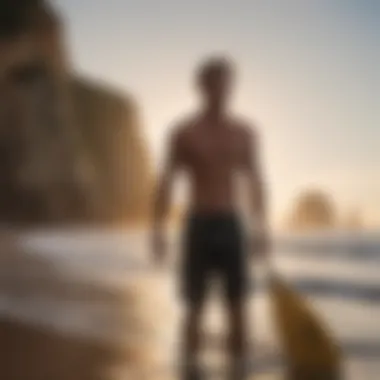 Close-up of surfer holding a paddle on the beach