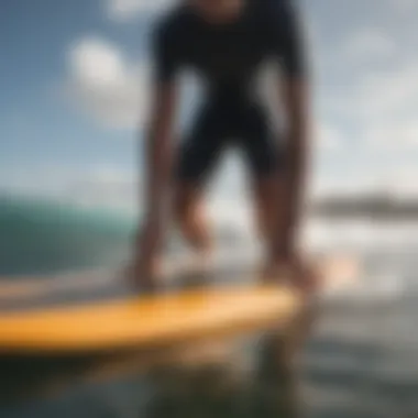 Surfer testing traction pad on surfboard