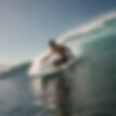 A surfer gliding through waves, illustrating the impact of fin selection on performance.