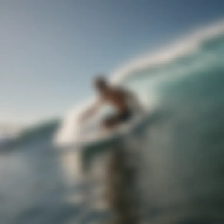 A surfer gliding through waves, illustrating the impact of fin selection on performance.