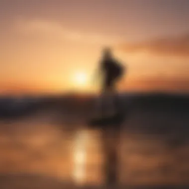 Surfer's silhouette against a vibrant sunset