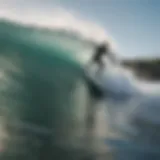 Surfer catching a wave at a scenic beach