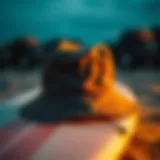 Stylish bucket hat resting on a surfboard