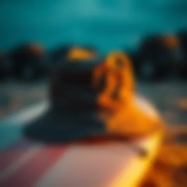 Stylish bucket hat resting on a surfboard