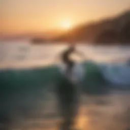 Surfer riding a wave at sunset