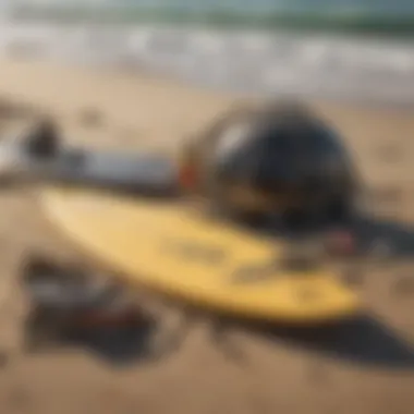 Surfing gear laid out on sandy beach