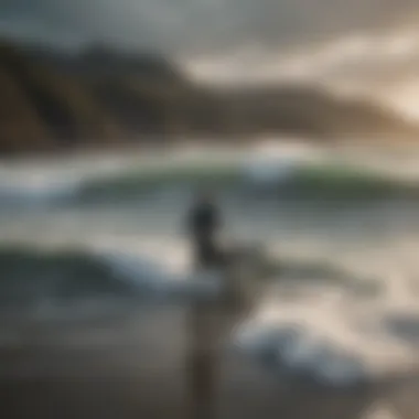 Waves crashing on the rugged coastline of Snowdonia with surfers catching the swell.