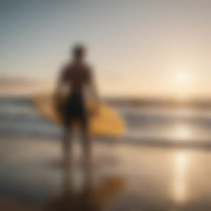 Surfer in a deep meditative pose on the beach with the surfboard beside