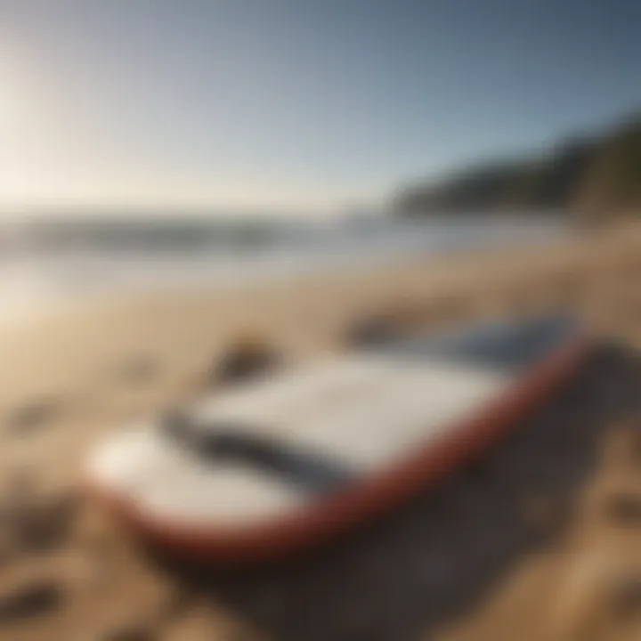 Surfing gear laid out on a sandy beach