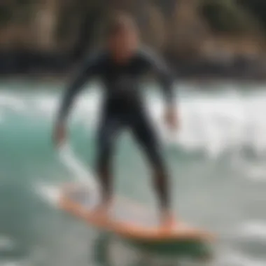 Surfing instructor demonstrating proper stance on a longboard