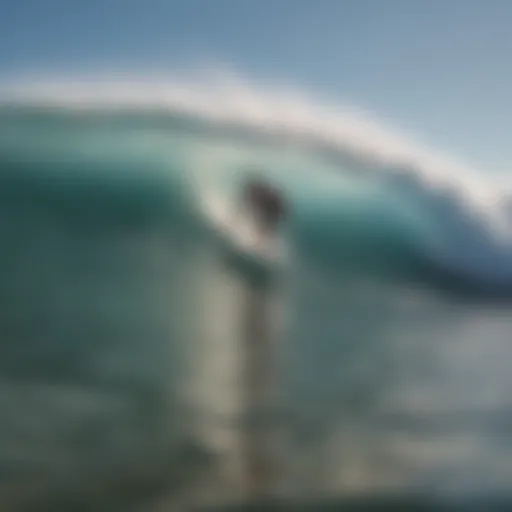 Surfer catching a wave at Surfrider Inn