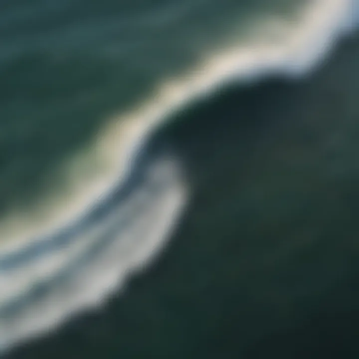 Aerial view of perfectly formed waves breaking along the shoreline