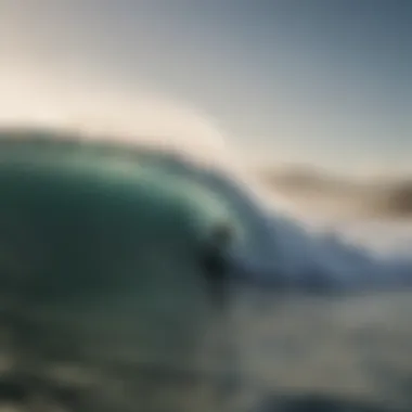 Surfboarder riding a wave on a cool misty morning