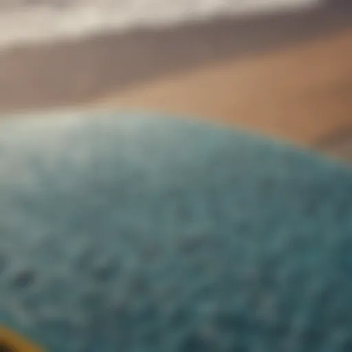 Close-up view of a surf stomp pad on a surfboard showcasing its texture and grip.