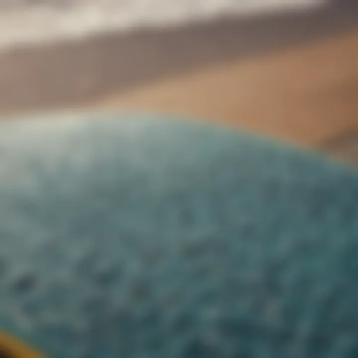 Close-up view of a surf stomp pad on a surfboard showcasing its texture and grip.