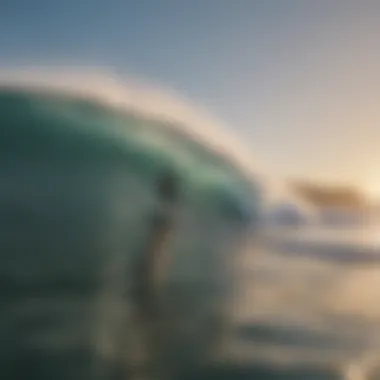 Aerial view of surfers catching waves at dawn