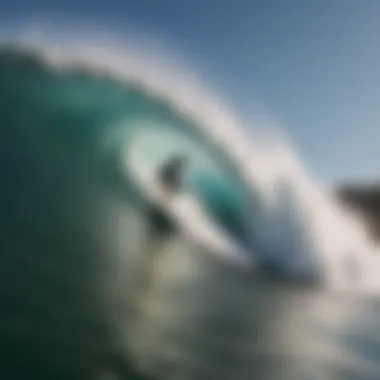 Surfer navigating a steep wave at The Wedge, demonstrating advanced surfing techniques.