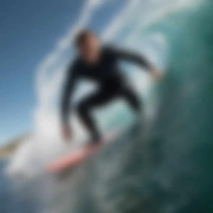 Surfer carving through a crystal clear barrel