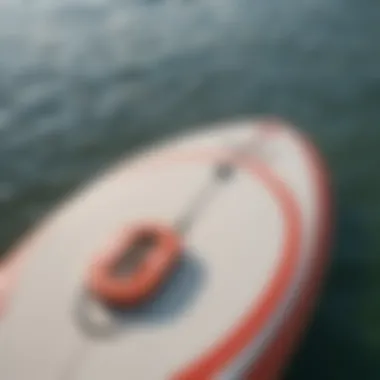 Close-up view of a paddle board measuring tape highlighting its length and width.