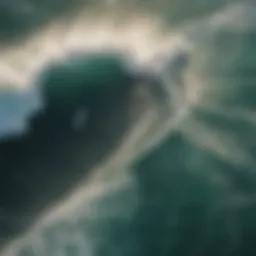 Aerial view of a stunning point break showcasing the waves hitting the shore