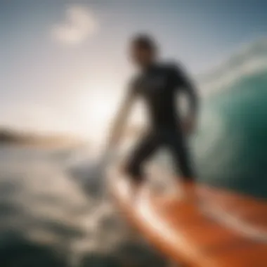 Surfboard enthusiast using shark deterrent bands in the ocean