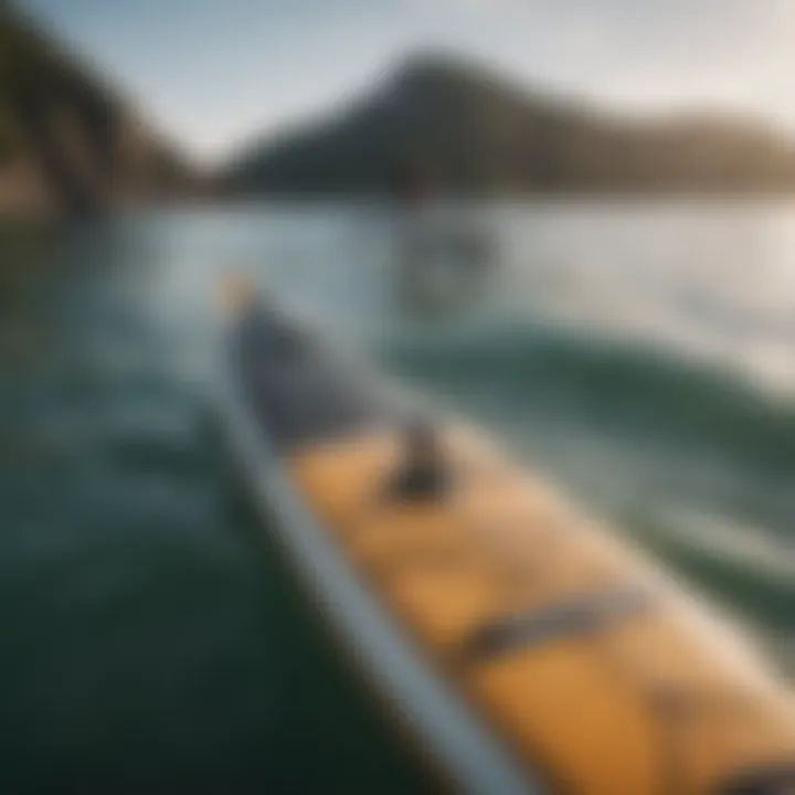 Close-up of a paddleboard with highlighted features and specifications.