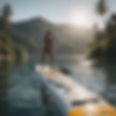 A serene water scene capturing an individual engaging in paddleboarding.