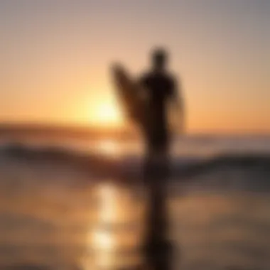 Surfer silhouette at sunset