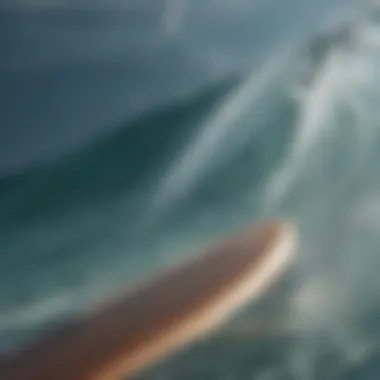 Close-up of surfboard fins slicing through crystal clear water