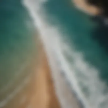 Aerial view of surfers lining up for waves in a tropical paradise