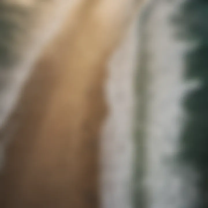 Aerial view of surfers catching waves along the coastline